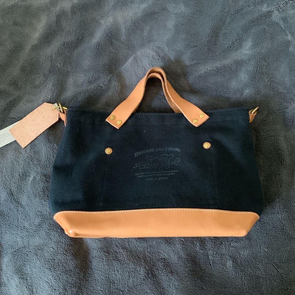 Chic Black and Tan Mini Bag with Leather Trim